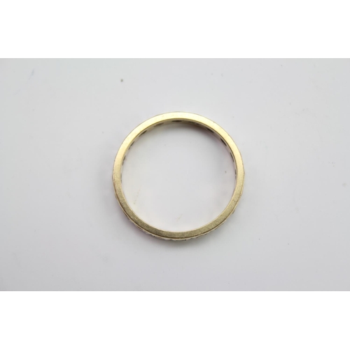 79 - A 9ct Gold Eternity Band mounted with Chip Diamonds. Size approximately P/Q. Weight approximately 2.... 