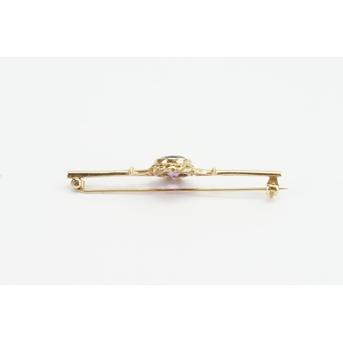 91 - A 9ct Gold and Amethyst Brooch, set with one oval Amethyst. Weight approx 3.8 grams. Size approx 1.8... 