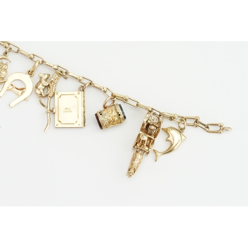 99 - A 9ct Gold Charm Bracelet with various charms to include a Coach & Horse, Rat, Corn on the Cob, Bird... 