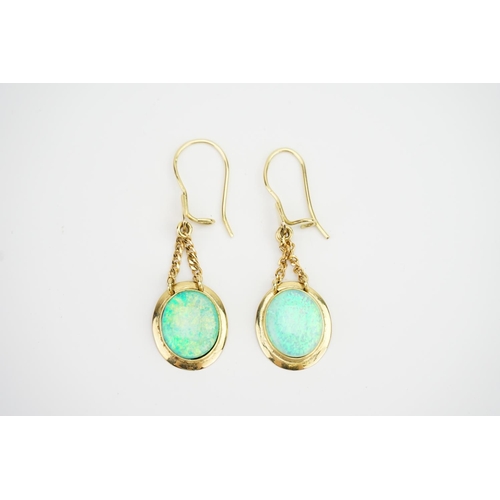 109 - A Pair of 18ct Gold Opal Doublet set Earrings. Weighing: 5.2 grams.