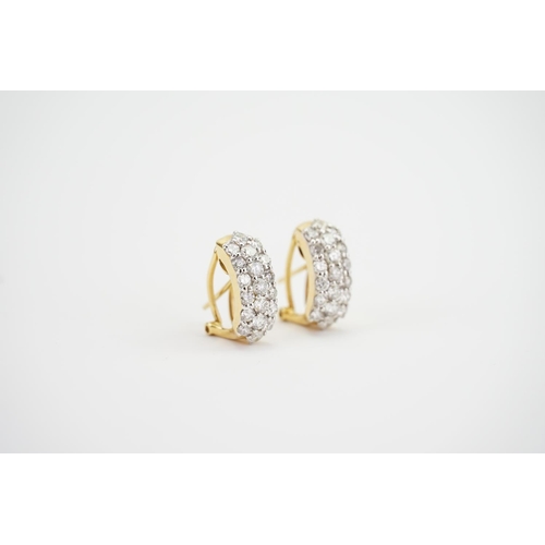 112 - A Pair of 18ct Gold Diamond Set Earrings in a 