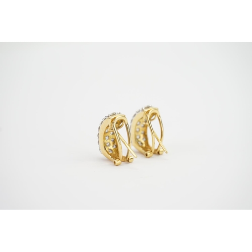 112 - A Pair of 18ct Gold Diamond Set Earrings in a 