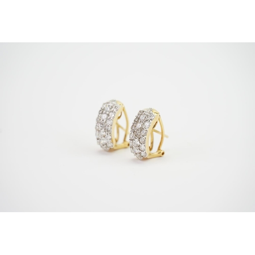 112 - A Pair of 18ct Gold Diamond Set Earrings in a 