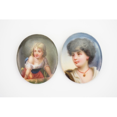 132 - Two Painted on Porcelain Swiss Plaques depicting a young girl & a similar older woman with a coral n... 