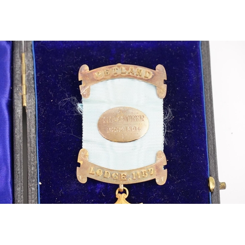 139 - A Masonic Freemasons Treasurer's medal for Lodge 1157, which is Zetland, awarded to Charles J. Cottr... 