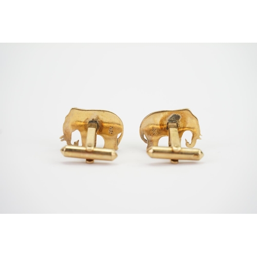 140 - A pair of Indian 18K Gold cufflinks designed as elephants set with star stones. Weighing: 8.2 grams.