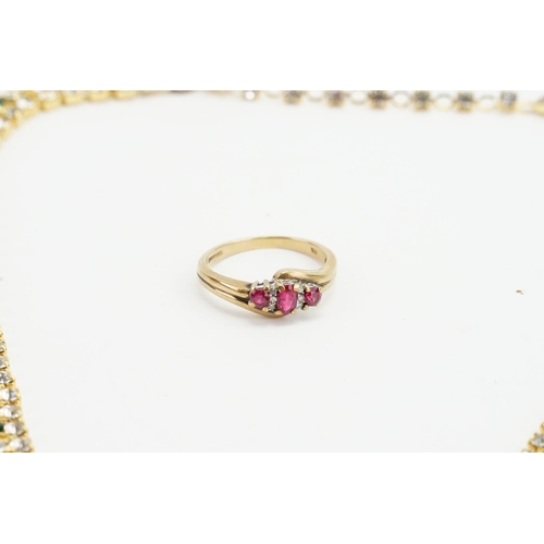 147 - A 9ct Gold Ruby and Diamond Set Ring along with a costume necklace.