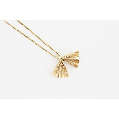 158 - A 9ct Gold chain hung with a 9ct gold bow pendant. Weight 4.3g.