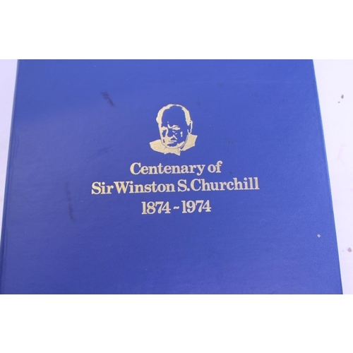 391 - A Winston Churchill Stamp Album containing a selection of World Stamps & a Collection of First Day C... 