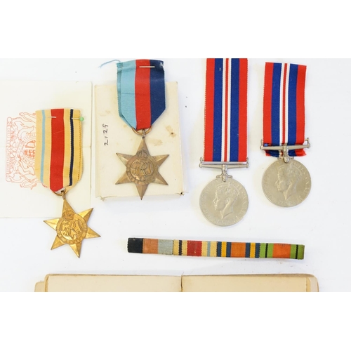 665 - WWII Medals to include 2 x Defence, 1939-1945 Star & an African Star.