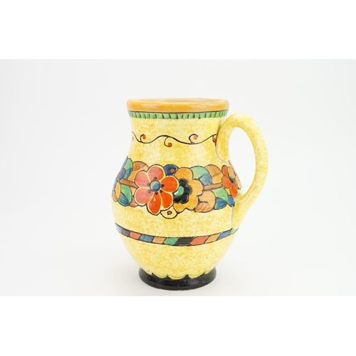 908 - A large Art Deco floral bordered pottery jug by Crown Ducal, decorated with summer flowers.