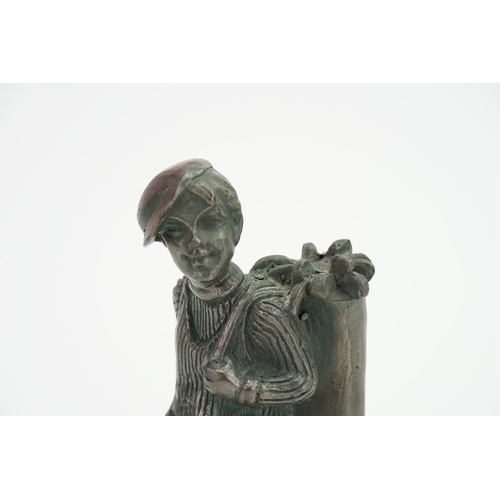 708 - A 1920s/30s Table Match Lighter designed as a golf caddy boy on a marble base.