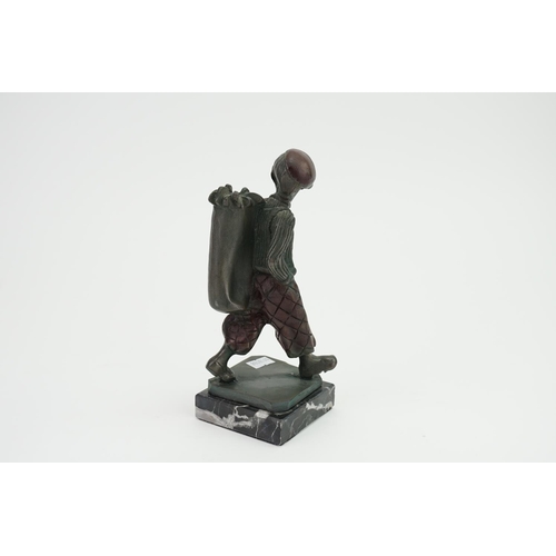 708 - A 1920s/30s Table Match Lighter designed as a golf caddy boy on a marble base.