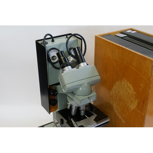 705 - A Micro System 70 Twin Binocular Illuminated Microscope in Original Case.