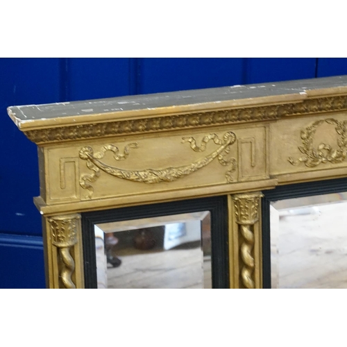 603 - A Georgian Gilt framed Three Panelled Bevelled Glass Over Mantle Mirror decorated with a frieze of T... 