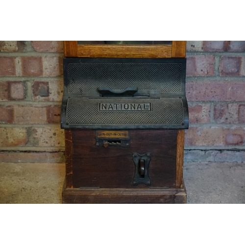 738 - A 1920s National Punch Operated Time Recorder with cast iron front along with key & Nickel Silver Ch... 