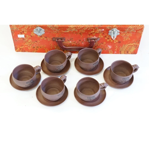 434 - A Chinese Ysing Tea Set consisting of Handled Tea Cups, Saucers, Teapot in Case.