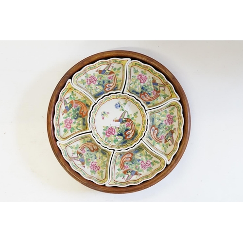 450 - A Lazy Susan containing seven various Chinese Asian Pheasant decorated Hors d'oeuvres Dishes.