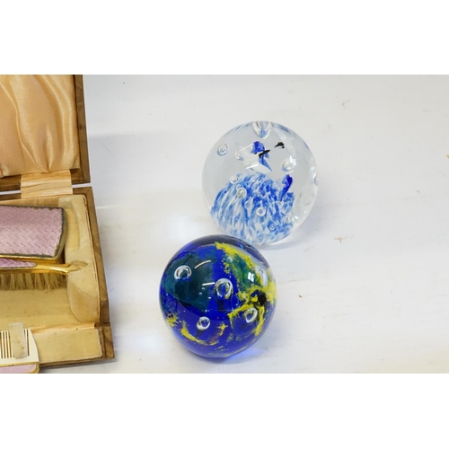 710 - A Modena design Glass Paper Weight, three others & a Gilt Metal three Piece Vanity Set in case.