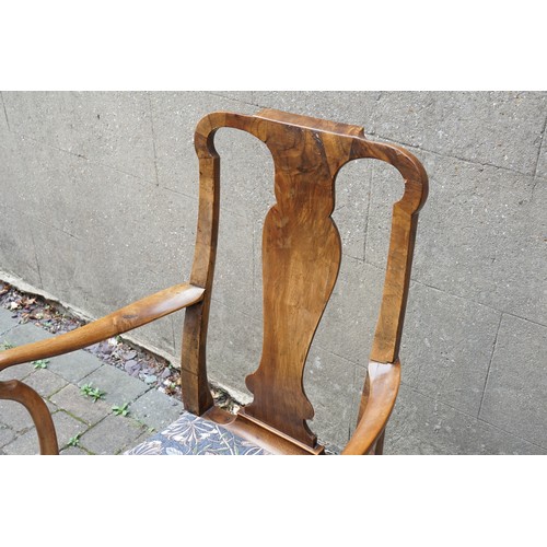 525 - A George I Walnut elbow chair with Shepherds Crook arms, circa 1720, from the NANTCLWYD Estate North... 