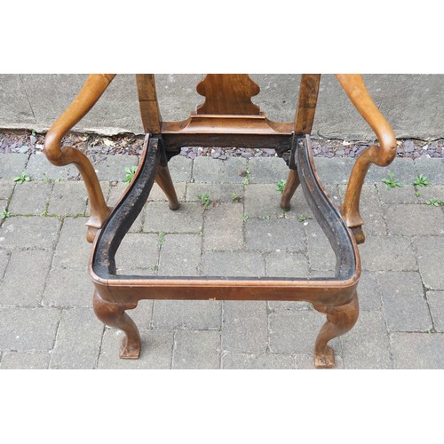 525 - A George I Walnut elbow chair with Shepherds Crook arms, circa 1720, from the NANTCLWYD Estate North... 