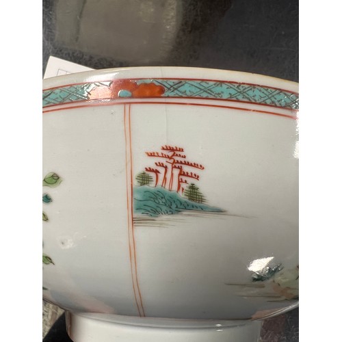 454 - A Chinese Famille Verte Punch Bowl decorated with different scenes.