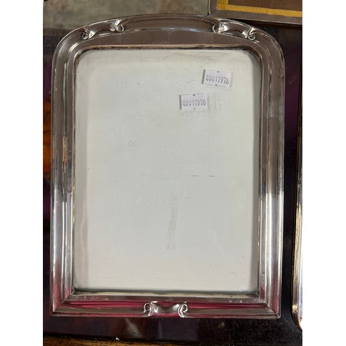 26 - Two Silver Photograph Frames with scrolling decoration & Plain along with one other Silver square.