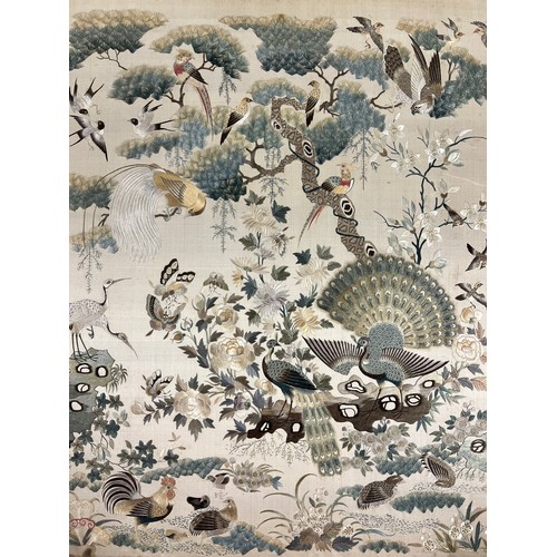 447 - A Chinese embroidered picture depicting peacocks and cranes, fitted into a fire screen. On inspectio... 