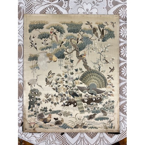 447 - A Chinese embroidered picture depicting peacocks and cranes, fitted into a fire screen. On inspectio... 