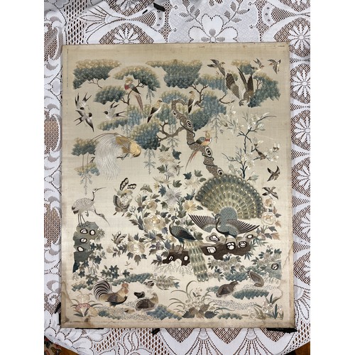 447 - A Chinese embroidered picture depicting peacocks and cranes, fitted into a fire screen. On inspectio... 