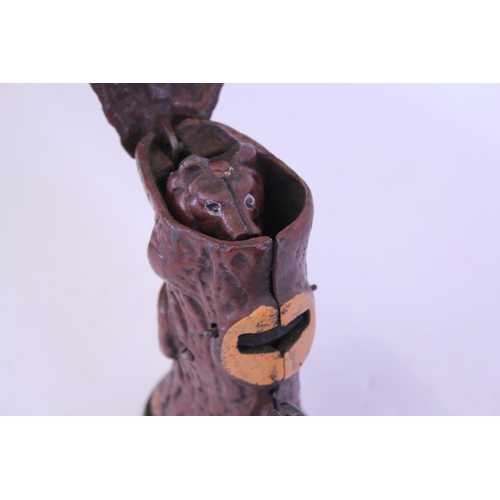 387 - A 20th Century Cast Iron Money Box Toy depicting a Man Shooting a Bear coming out of a tree stump.