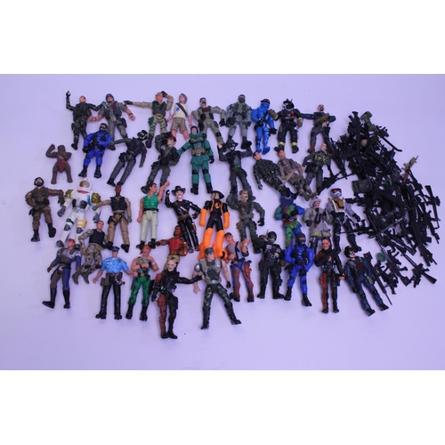 141 - A collection of various action figures to include a large amount of weapons and accessories.