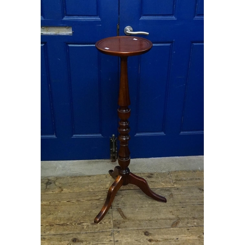 588 - A Reproduction Mahogany Jardiniere Stand with a turned Column & a Tripod Base. Measuring: 100cms Hig... 