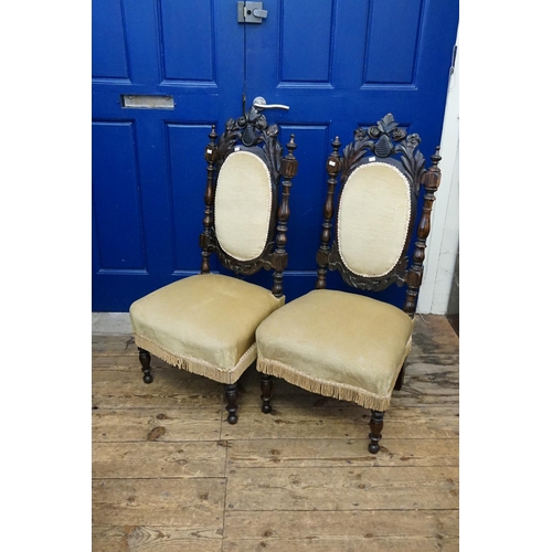 590 - A Pair of Late 19th Century Carved back and turned fronted low down sewing chairs resting on turned ... 