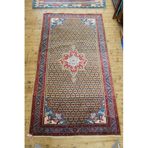 286 - A Large Red, Blue & Cream Rug. Measuring: 300cms x 165cms.