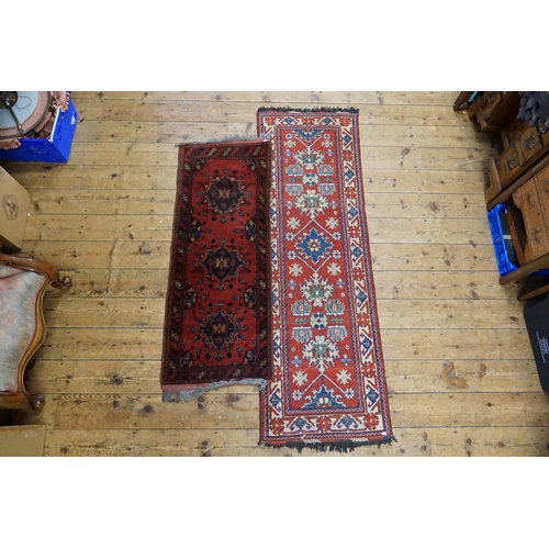 287 - Two Red Runners. Measuring: 203cms long x 66cms across. (Large One). 150cms Long x 59cms across. (Sm... 