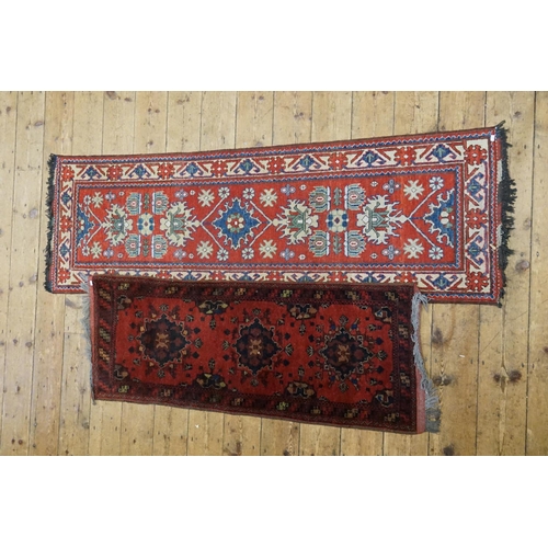 287 - Two Red Runners. Measuring: 203cms long x 66cms across. (Large One). 150cms Long x 59cms across. (Sm... 