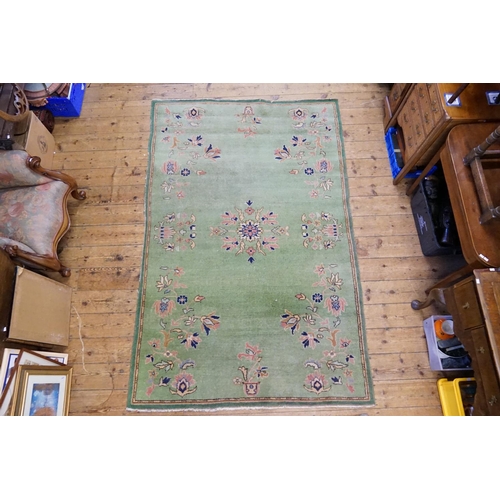 288 - An All-Over Green Rug. Measuring: 156cms x 246cms.