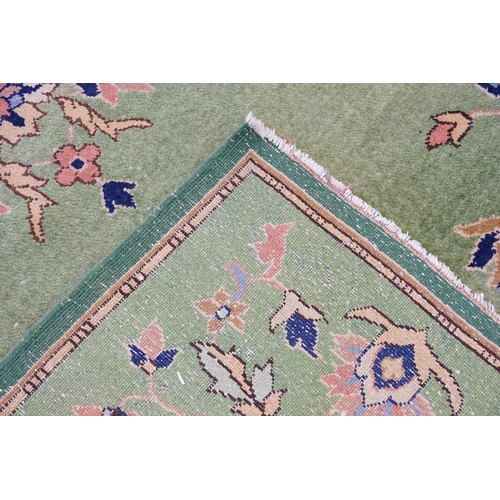 288 - An All-Over Green Rug. Measuring: 156cms x 246cms.