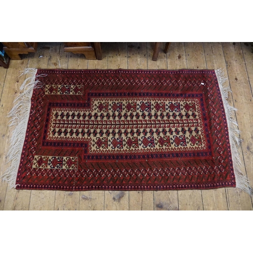 292 - A Red Ground Prayer Rug with a Twin Geometric design, Central Fish Scale pattern, cream and blue dia... 