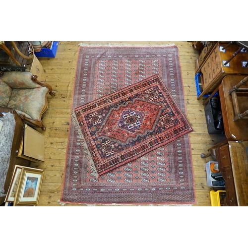 295 - Two Red Ground and Blue Rugs. (Small: 160cm x 117cm) (Large: 274cm x 188cm).