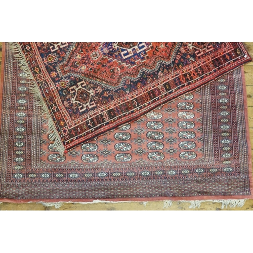 295 - Two Red Ground and Blue Rugs. (Small: 160cm x 117cm) (Large: 274cm x 188cm).