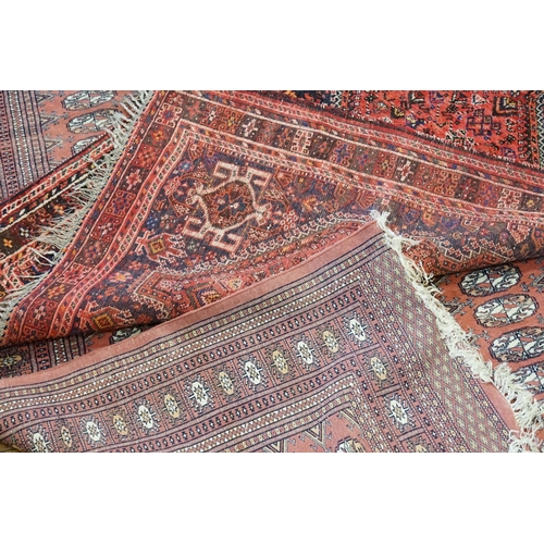 295 - Two Red Ground and Blue Rugs. (Small: 160cm x 117cm) (Large: 274cm x 188cm).