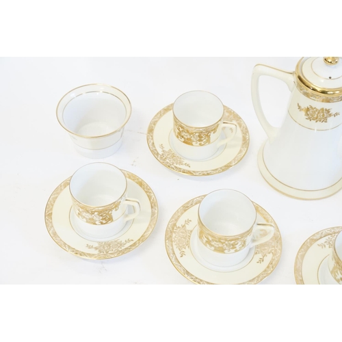 948 - A Japanese Gilt Floral bordered coffee set marked 