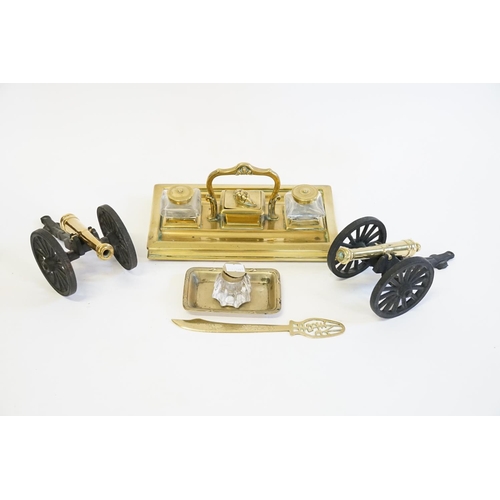 361 - A Victorian Brass Stand Dish, a Silver Plated Ink Well & two brass Canons on Carriages.