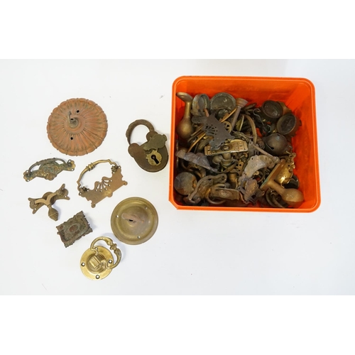 366 - A box of Victorian and Edwardian ceiling bosses, latches, cat badges, padlocks, etc.