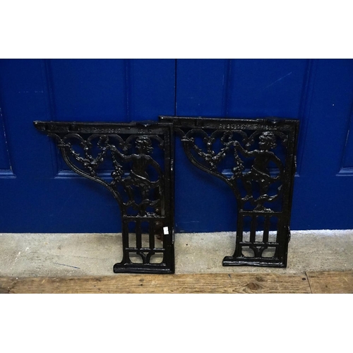 367 - A Pair of Cast iron toilet basin brackets cast with a cupid. Number: RD299967.