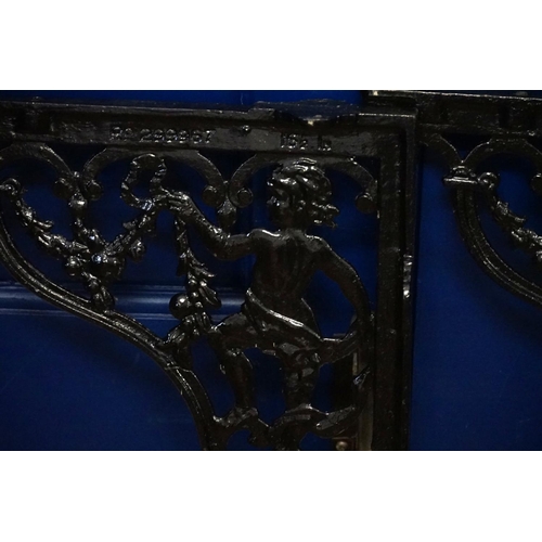 367 - A Pair of Cast iron toilet basin brackets cast with a cupid. Number: RD299967.