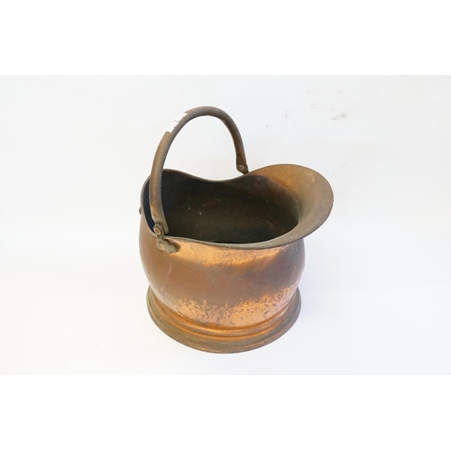 370 - A Copper helmet shaped coal scuttle.