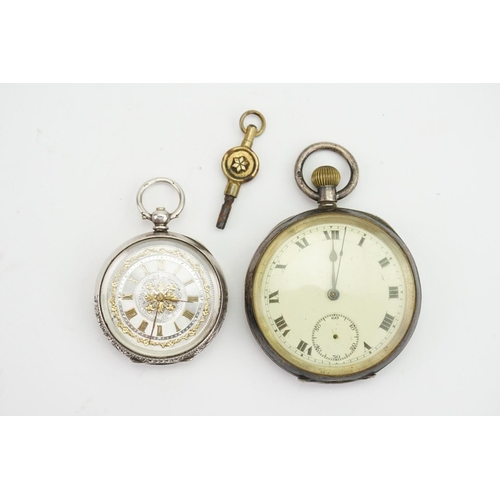 228 - A Silver engraved Ladies pocket watch along with a larger silver pocket watch & Key. (AF).